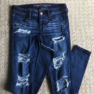 Distressed dark wash jeans